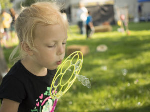 Blowing bubbles at the Kids Games of Old