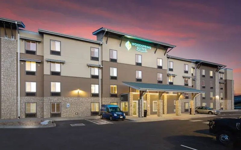 Photo of entrance to Woodspring hotel.